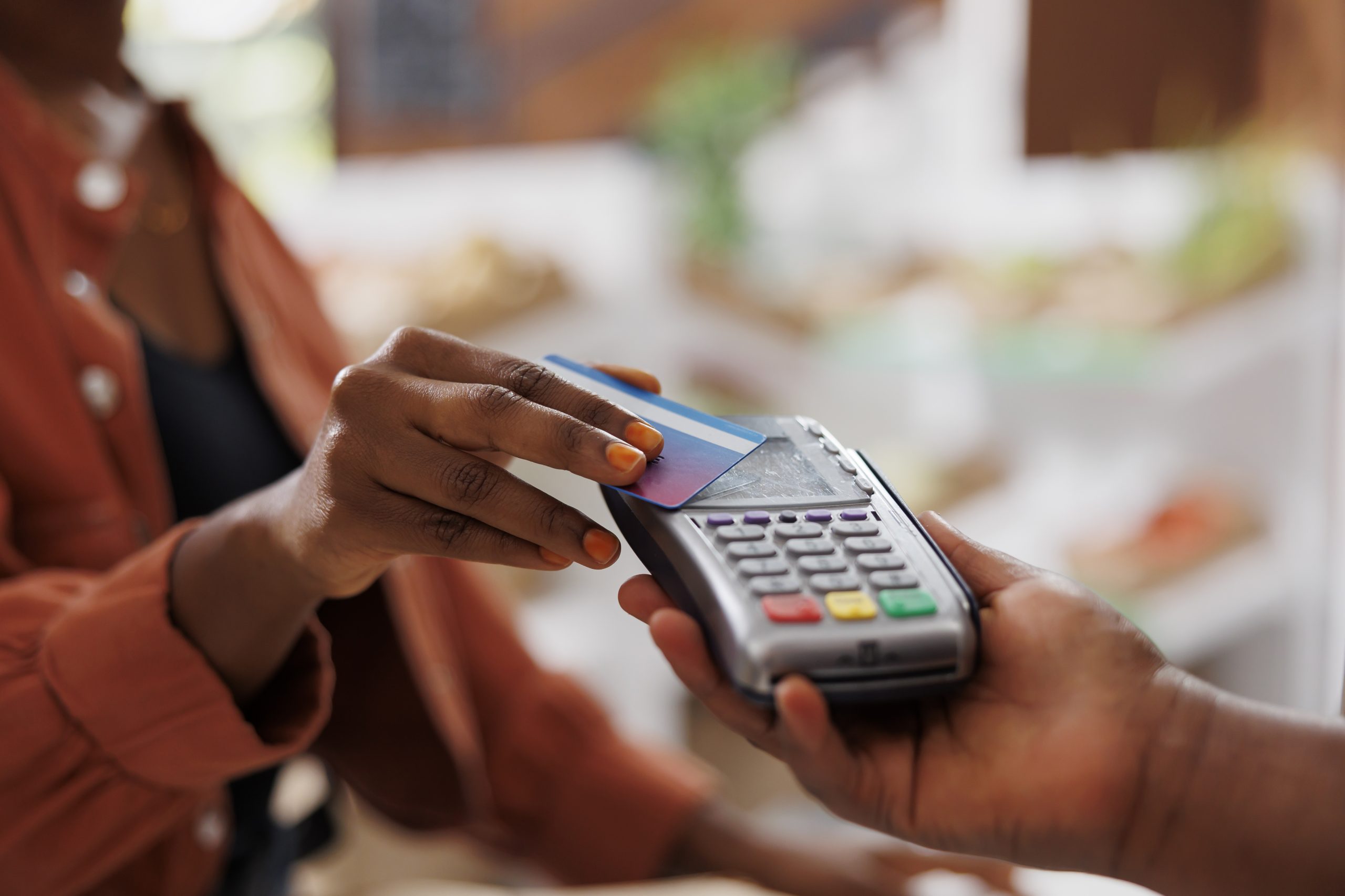 Black person using card for payments