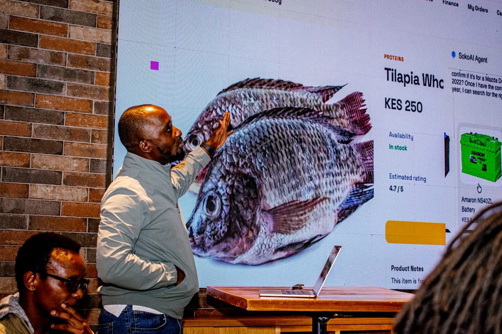 Pawa IT CTO Oscar Limoke demonstrating SokoAI, a multi-agent AI system, with its conversational agent UI and Kenyan product catalog at Cloud Mastery 2026 in Nairobi.